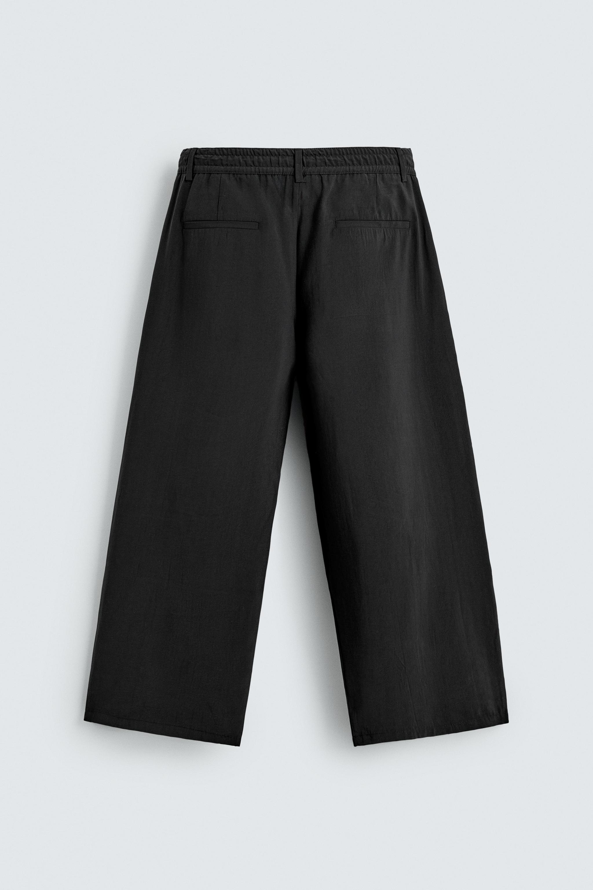 FLOWY PLEATED PANTS